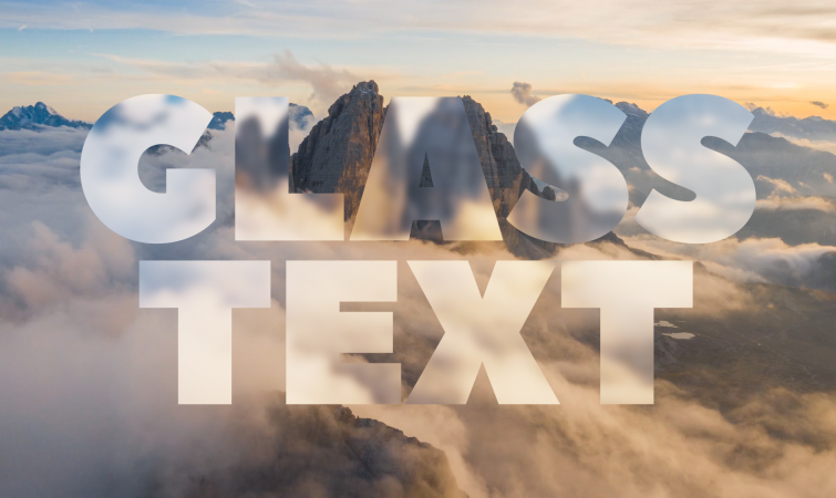 The words "Glass Text" in the foreground with a mountain shrouded in clouds in the background