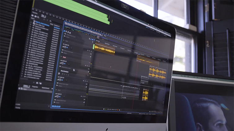 Closeup of an editor applying Adobe Remix