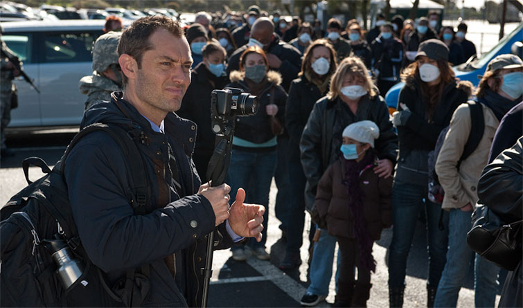 Jude Law as a reporter in the film Contagion