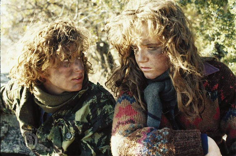 Closeup of actors in camoflage in the film Red Dawn