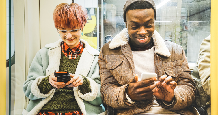 Hipster teens on social media while riding the subway