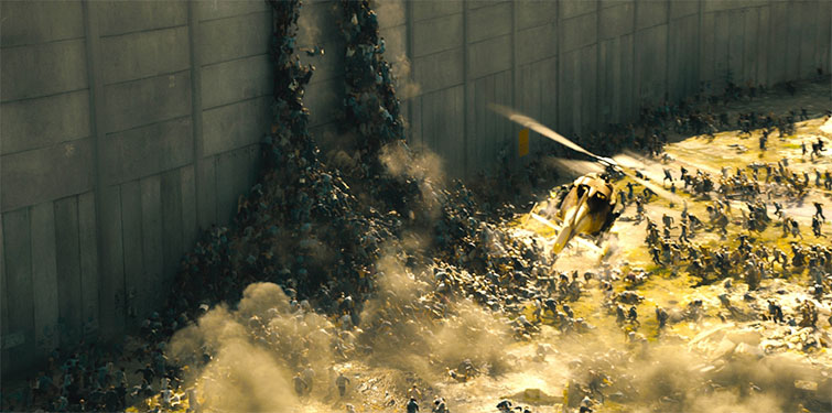 Zombie's climbing a city wall in the movie World War Z
