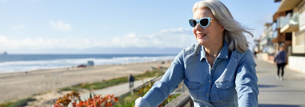 Older woman living her best life listening to May's royalty free music