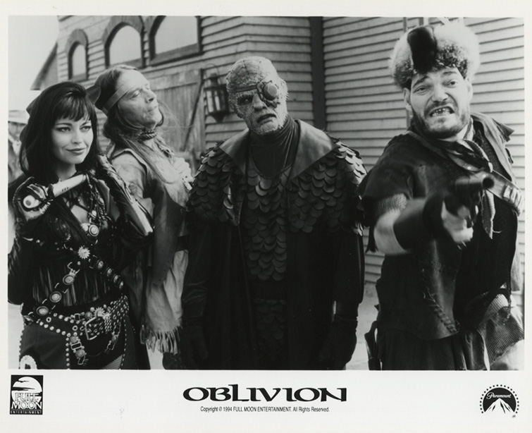Black and white promotional image from Oblivion showing characters against an Old West-styled background (1994)