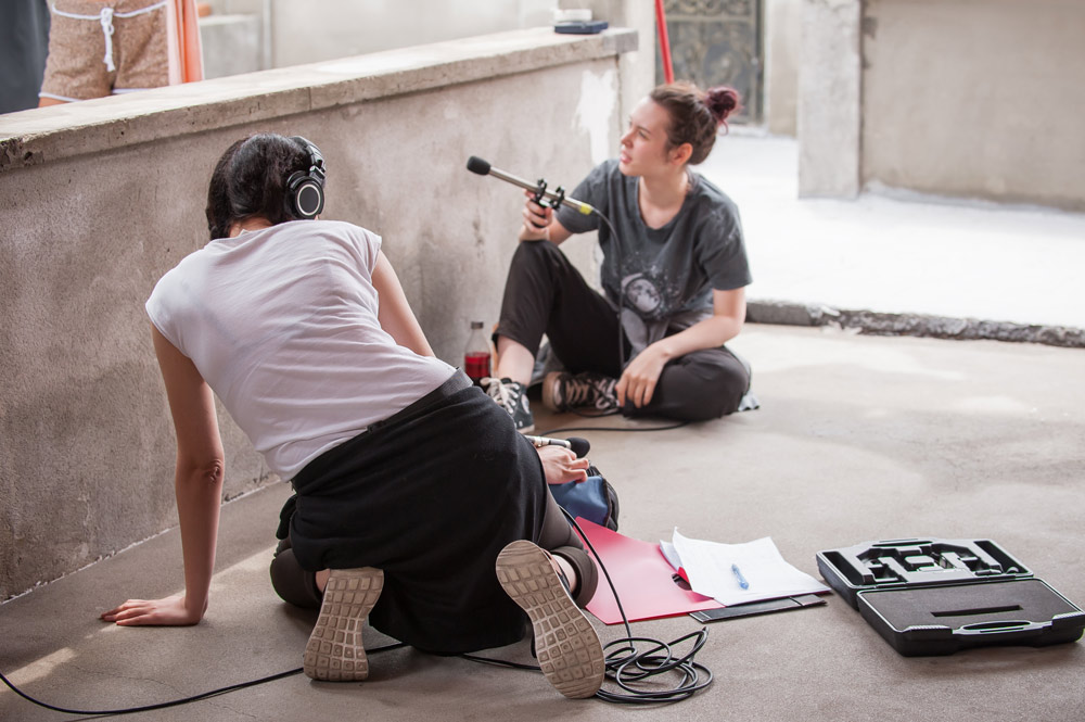 Microphone Operator and sound mixer running production audio