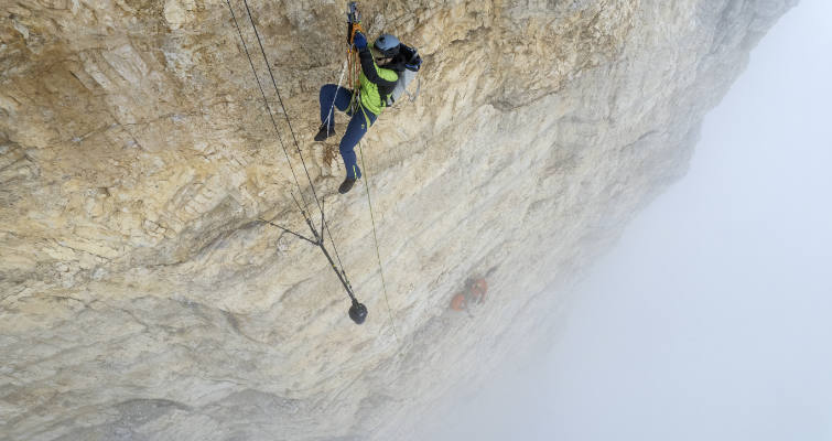 Screenshot from The Soloist of a climber on a cliffside