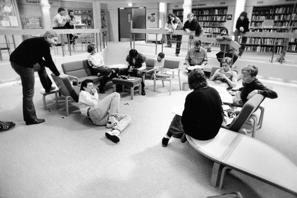 Black and white image of John Hughes on the set of The Breakfast Club