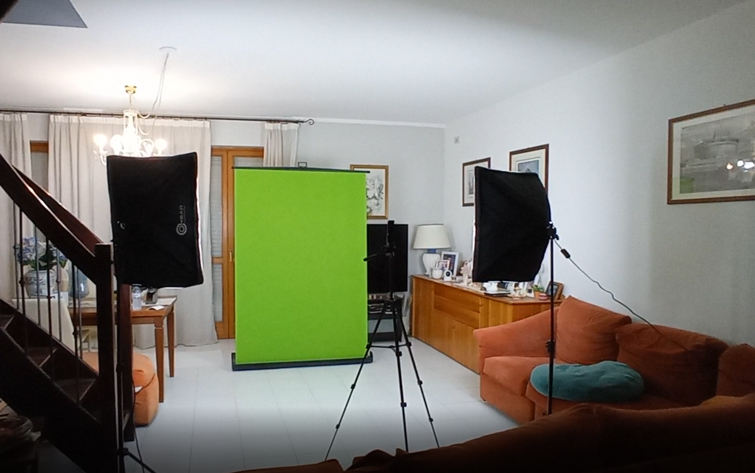 A rolling green screen set up in a living room