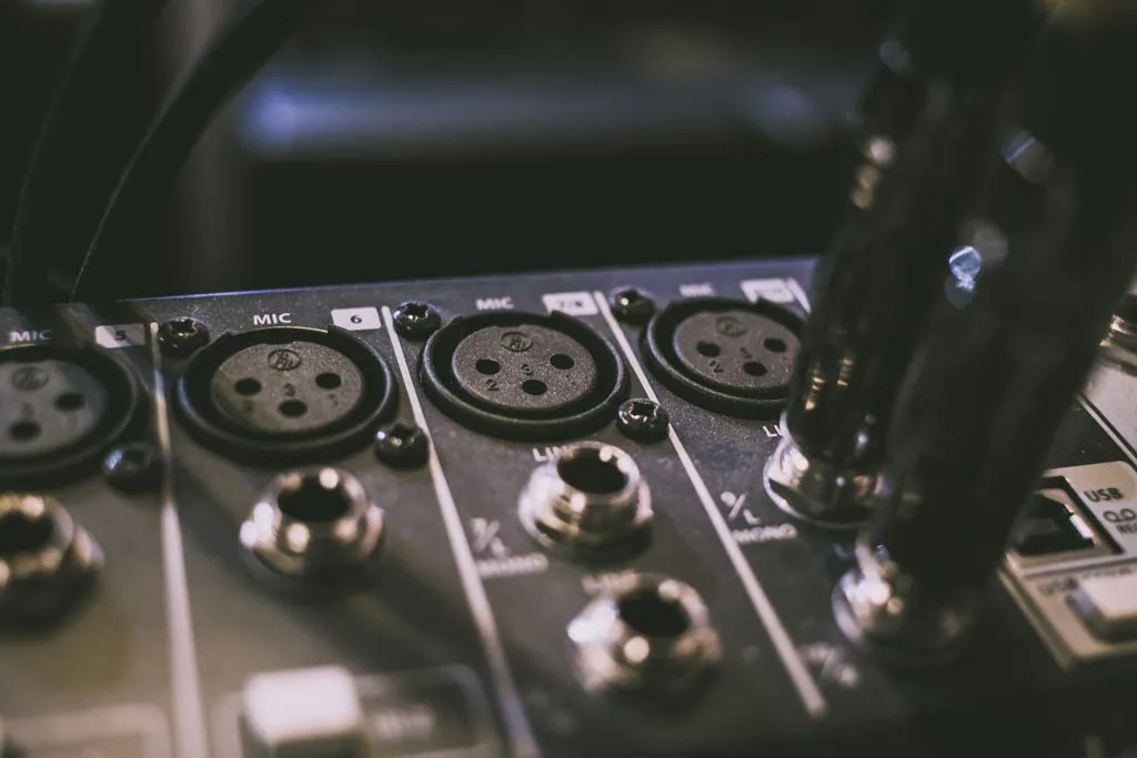 Closeup of phone jack mixer on audio mixer